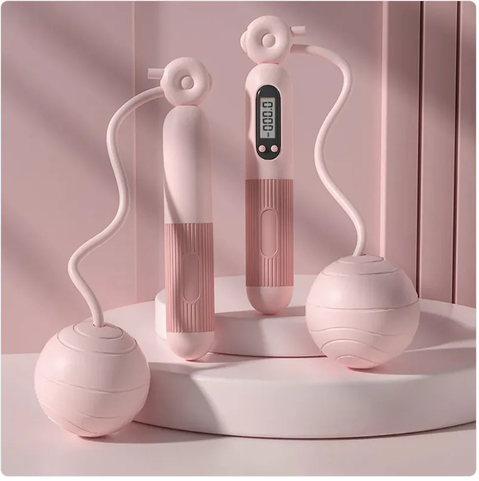 Pink jump rope with digital display on a pink background